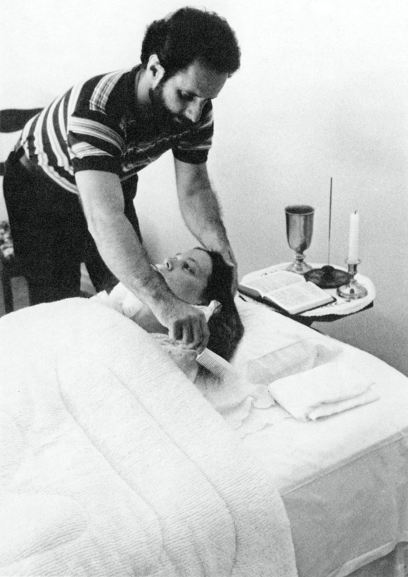 Jim McCarty combing Carla Rueckert's hair before a Law of One session